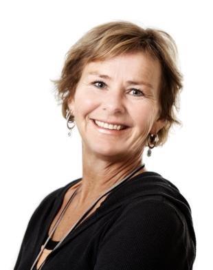 Bilde av prosjektleder Ingunn Studsrød. En dame iført sort cardigan med med kroppen vendt vekk fra kameraet, mens hodet er vendt mot. Hun smiler.